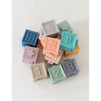 Colorful silicone blocks set for children, featuring various shapes and sizes, designed for stacking and educational play.
