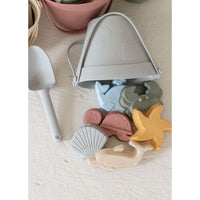 Colorful silicone sand toy bucket with matching shovel and toys for kids' outdoor play, by ShopMyLittleSongbird.