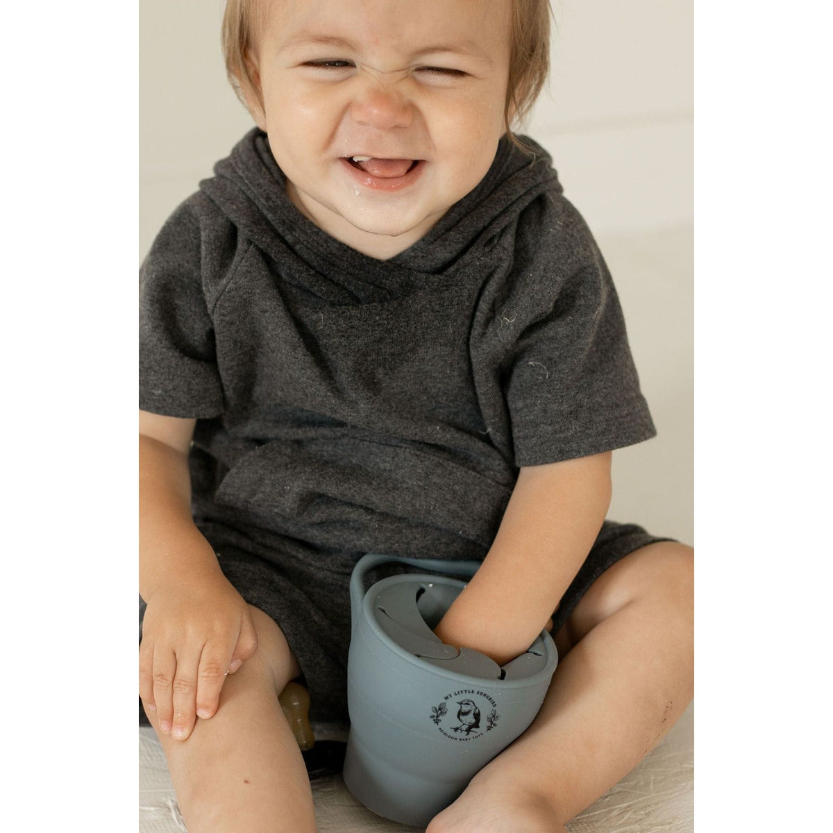 Silicone collapsible snack cup from ShopMyLittleSongbird, portable bowl with a lid, ideal for holding snacks for kids.