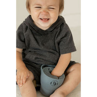 Silicone collapsible snack cup from ShopMyLittleSongbird, portable bowl with a lid, ideal for holding snacks for kids.
