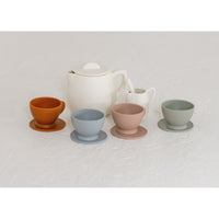 Colorful silicone toy tea set with cups, teapot, and utensils for children, designed for imaginative play and learning.