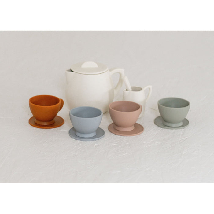 Colorful silicone toy tea set with cups, teapot, and utensils for children, designed for imaginative play and learning.