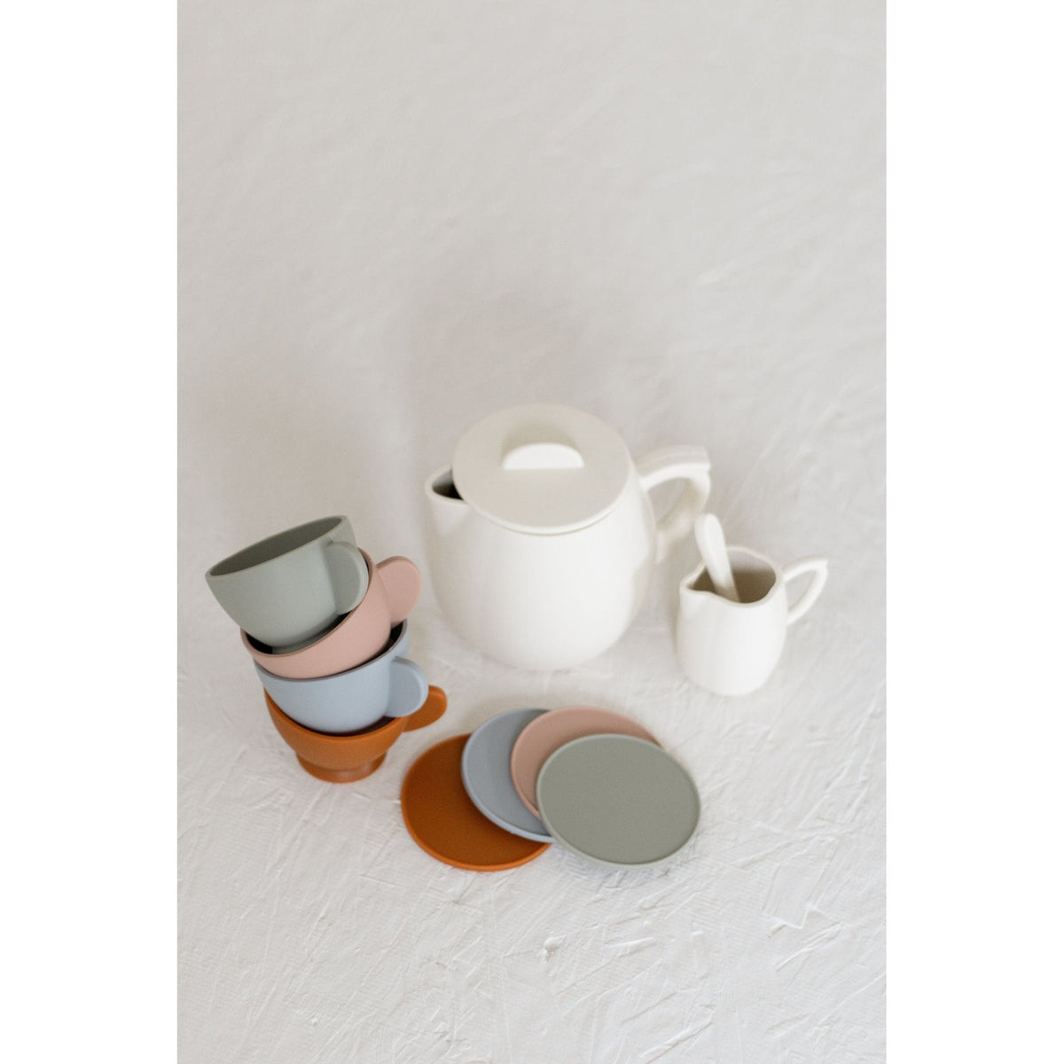 Colorful silicone toy tea set with cups, teapot, and utensils from ShopMyLittleSongbird, perfect for imaginative play for children.