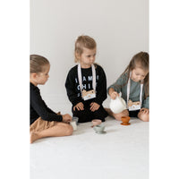 Colorful silicone tea set toy with cups, teapot, and utensils for children, designed for imaginative play.