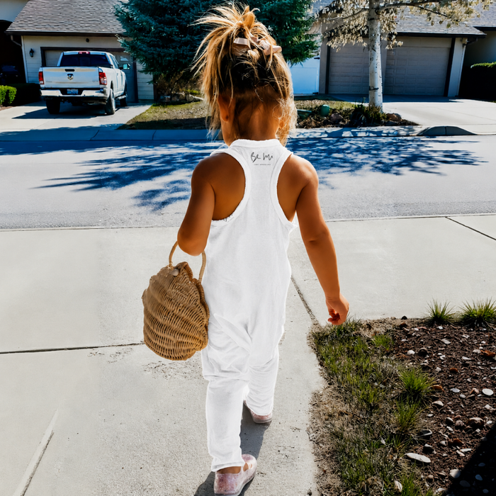 Be Mi Los Angeles white romper featuring a simple design, perfect for holiday or casual wear, shown on a model.