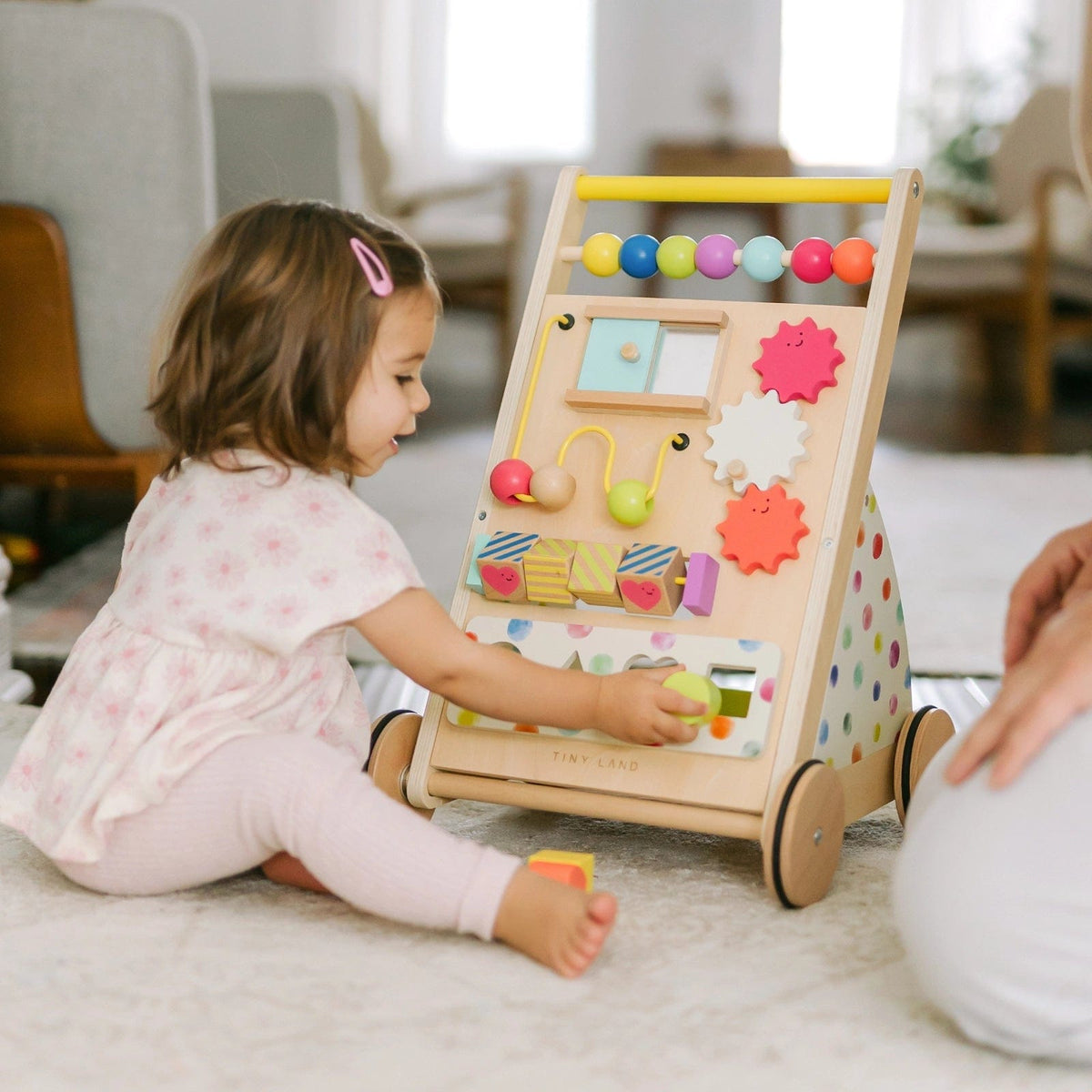 Natural wooden baby walker with colorful beads and smooth finish from Tiny Land INC, designed for early mobility and play.