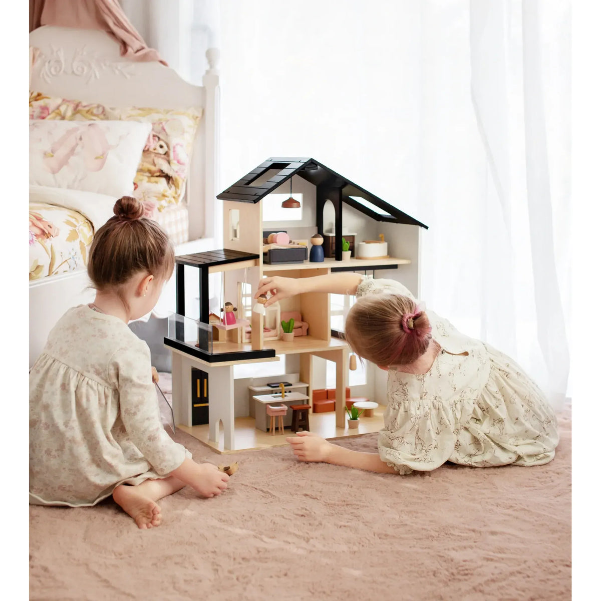 Tiny Land® Sweetwood Edge Dollhouse showing a detailed miniature wooden dollhouse with windows and furniture inside.