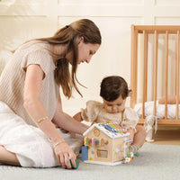 Tiny Land® Cottage Activity Cube in Morandi colors, featuring interactive panels and shape sorting for children.