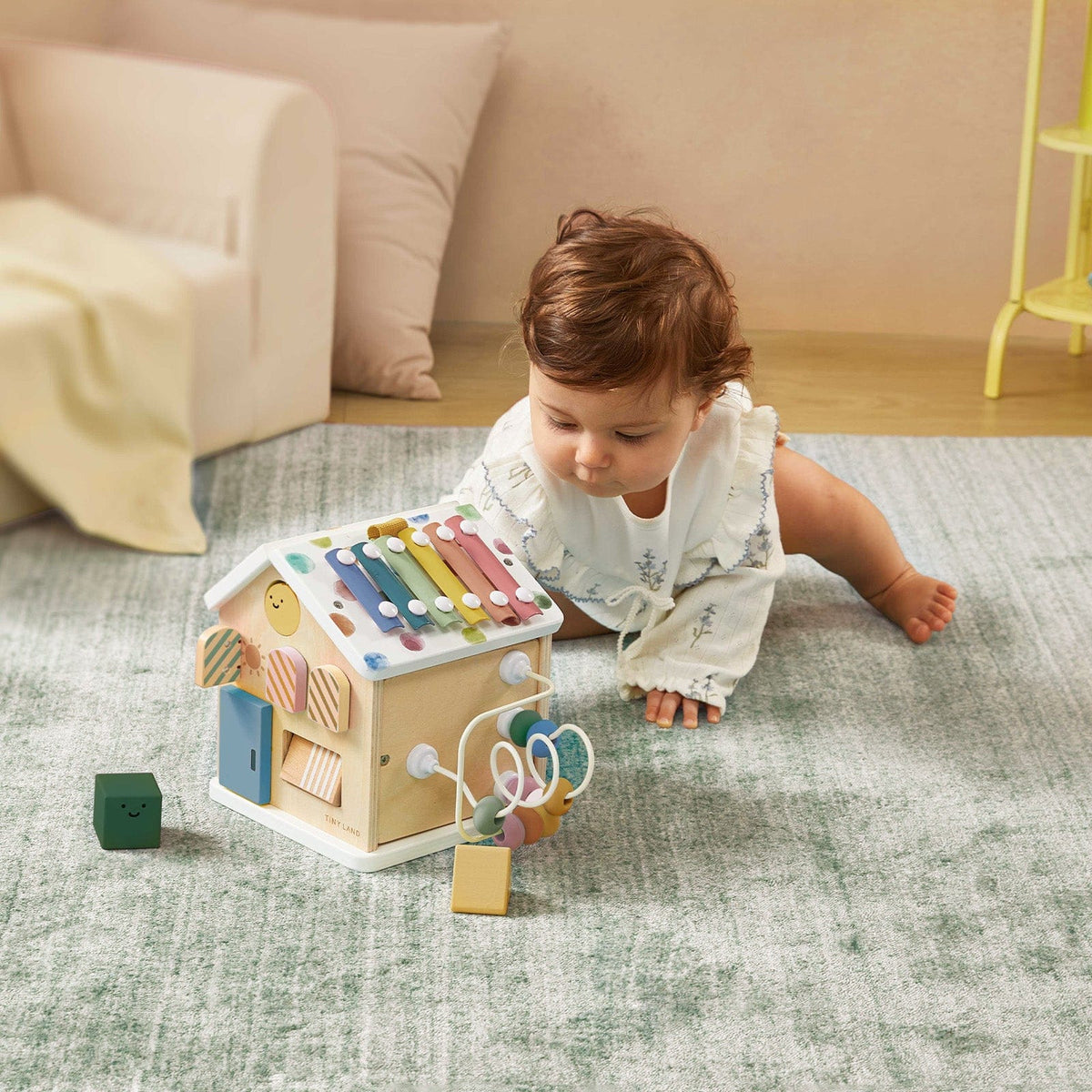 Colorful Tiny Land® Cottage Activity Cube with morandi tones, featuring puzzles, gears, and sensory elements for kids' play and learning.