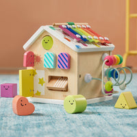 Colorful Tiny Land® Cottage Activity Cube with rainbow design, featuring engaging shapes and activities for children.