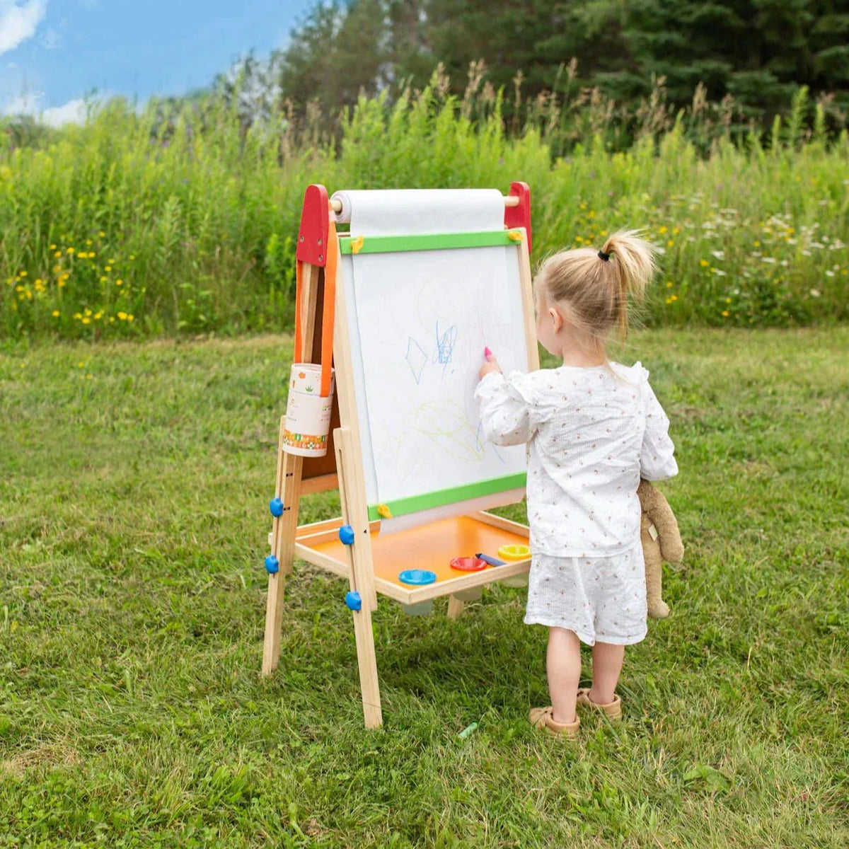 Tiny Land Kids Easel with 3-in-1 art surface and paper roll, featuring colorful paint and drawing areas for creative children.