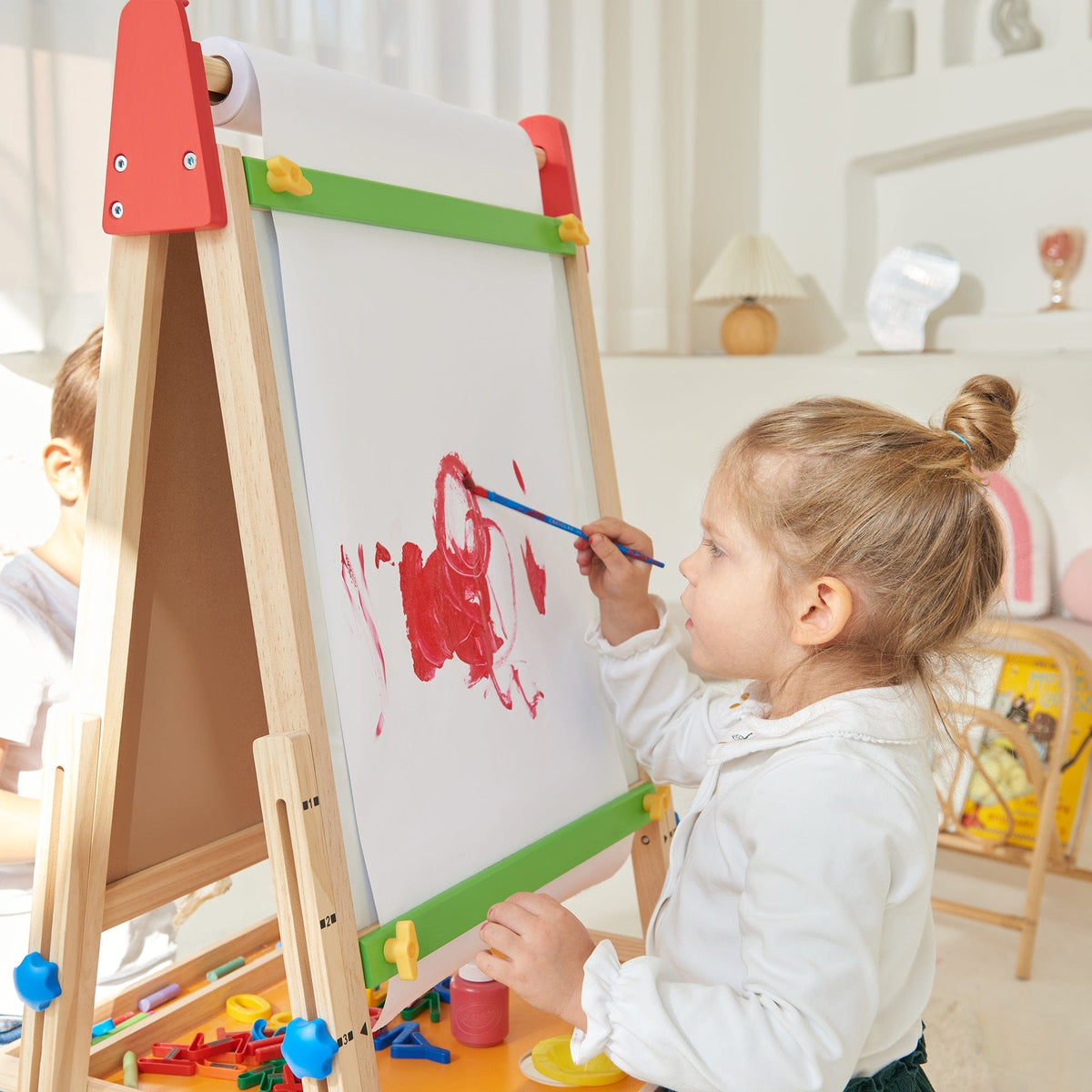 Tiny Land® 3-in-1 kids easel featuring a chalkboard, whiteboard, and paper holder for creative children's activities.
