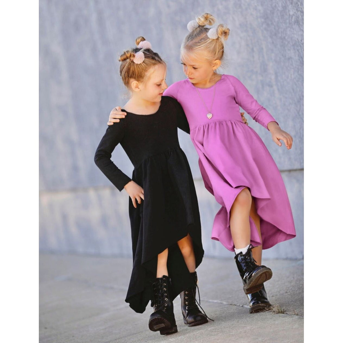 Long sleeve purple Organic Giselle Dress by Be Mi Los Angeles, soft fabric and elegant design, shown hanging on a mannequin.