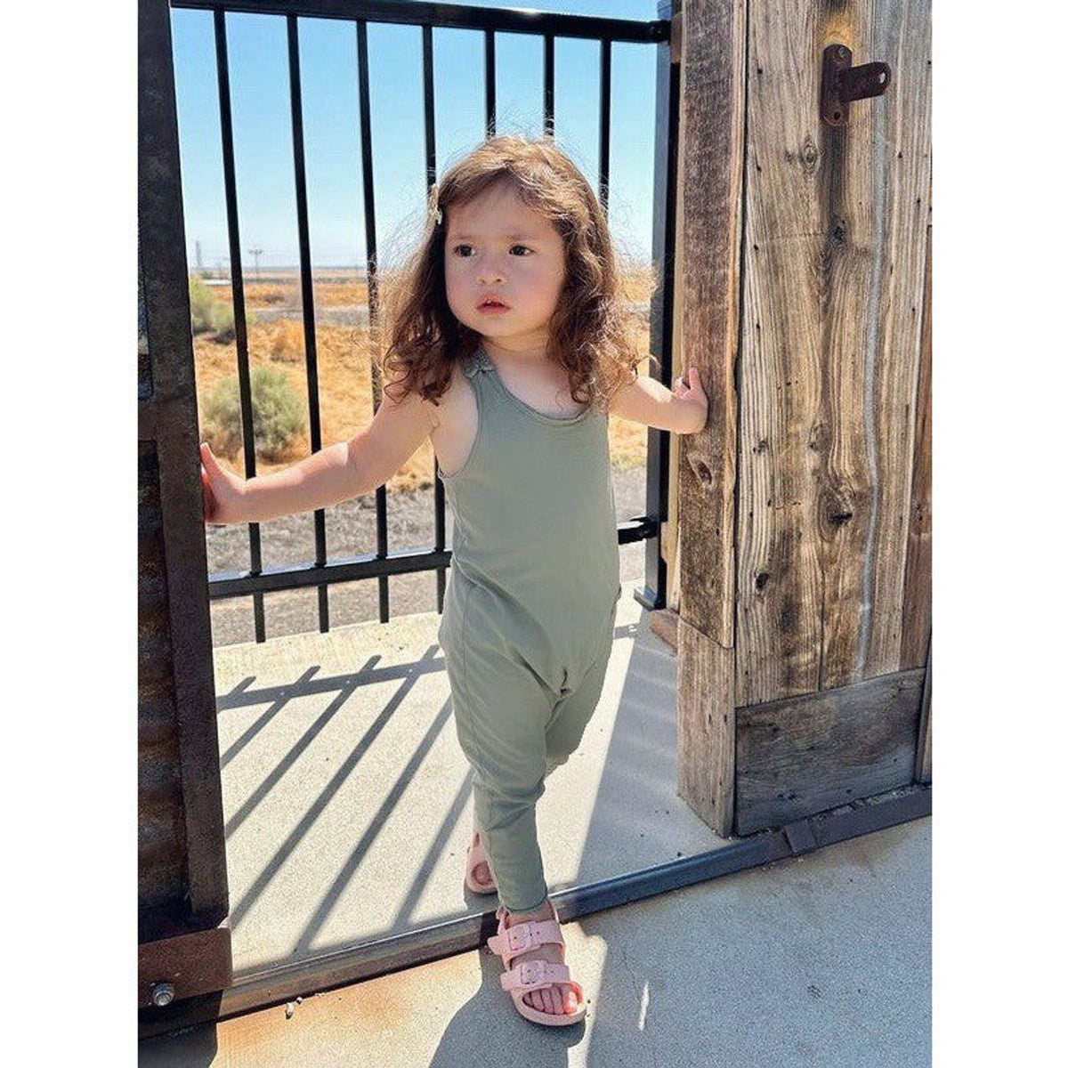 Olive green Be Mi Los Angeles romper featuring a relaxed fit and short sleeves, perfect for casual summer wear.