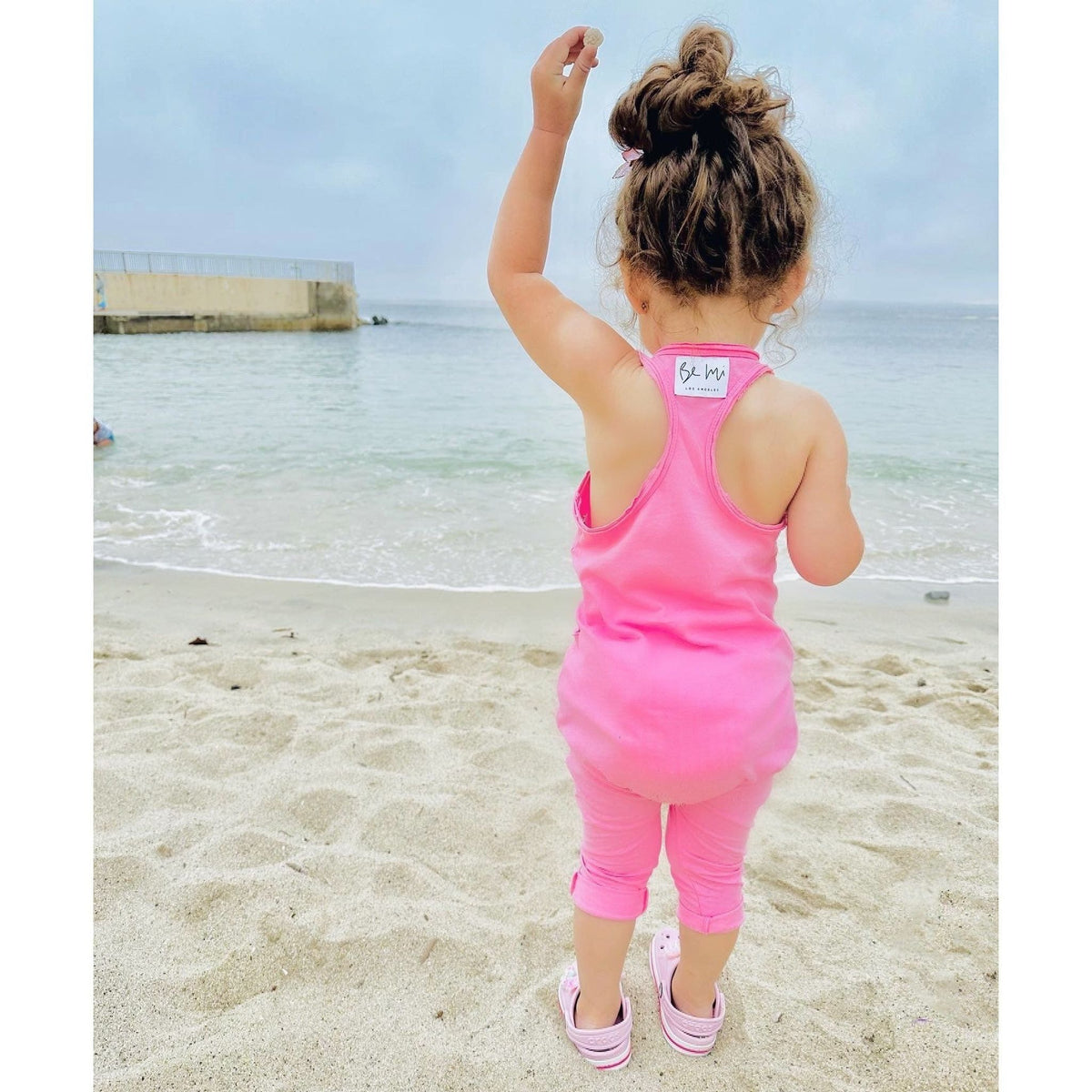 Be Mi Los Angeles bubble gum romper with playful design, featuring soft fabric and comfortable fit for kids.