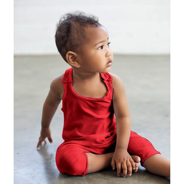 Red baby romper by Be Mi Los Angeles featuring soft fabric and playful design for infants.