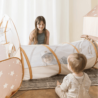 Children playing inside Tiny Land INC Discovery 5-in-1 mesh play tunnel without balls, ideal for active indoor fun and crawling.