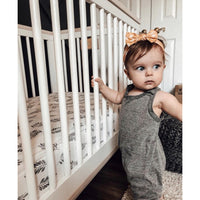 Heather grey romper by Be Mi Los Angeles, featuring a stylish, casual one-piece outfit with short sleeves and a relaxed fit.