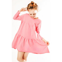 Be Mi Los Angeles Organic Alya Dress, flowy boho-style dress with floral pattern and long sleeves, displayed on a hanger.