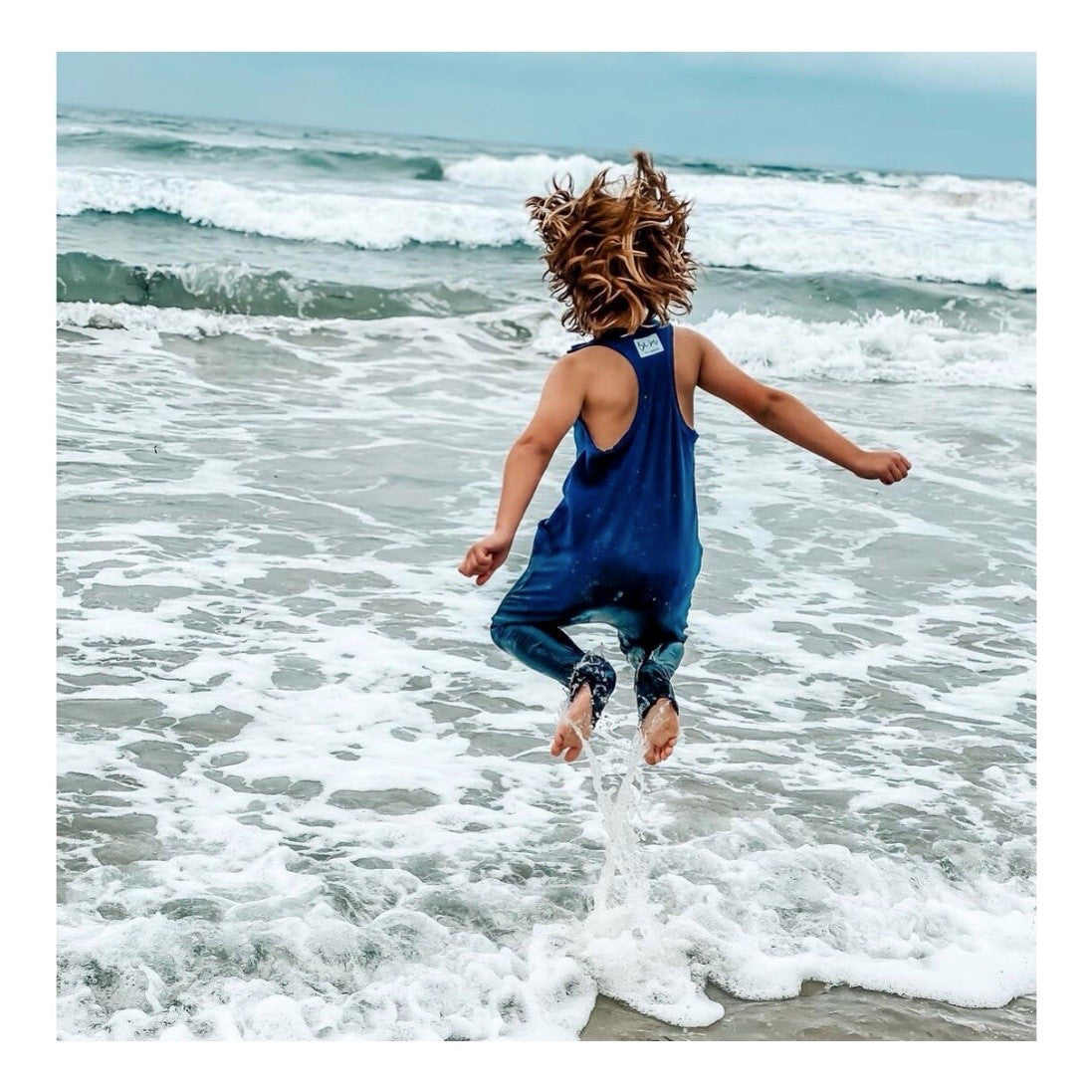 Navy Americana romper by Be Mi Los Angeles featuring a casual, stylish design perfect for warm weather.
