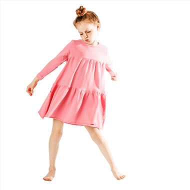 little girl wearing organic pink swing dress