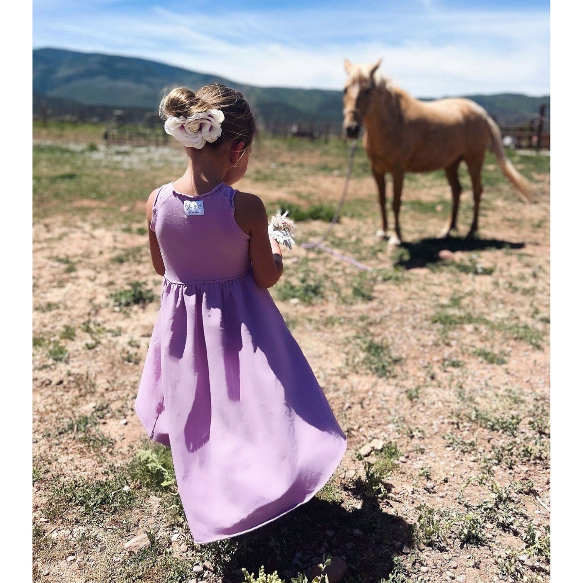 Purple organic Giselle dress by Be Mi Los Angeles, featuring flowy fabric and elegant design, shown in a stylish fashion image.