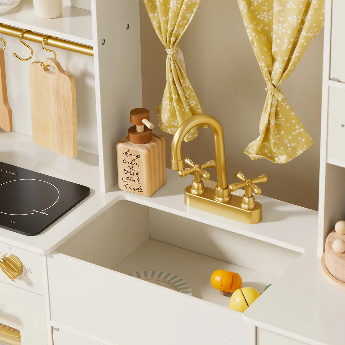 Tiny Land® wooden play kitchen in cream with pretend cooking accessories for kids, featuring realistic stove and countertop details.
