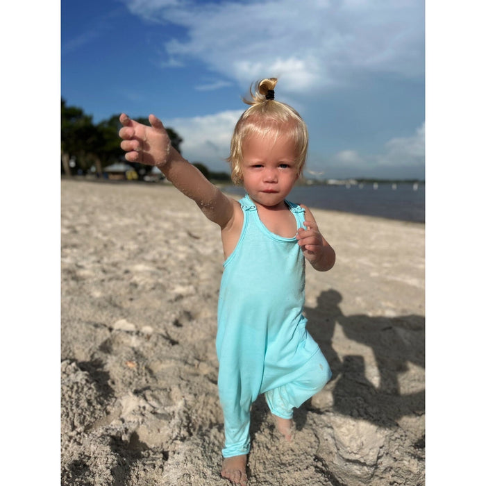 Be Mi Los Angeles aqua romper displayed on a hanger with a relaxed fit and sleeveless design, perfect for casual summer wear.