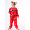 Child wearing a red outfit with a logo on a white background