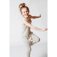 Be Mi Los Angeles limited edition striped romper in natural and black, shown on a model with a casual, stylish fit.