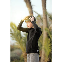 Black organic Benji kids’ hoodie from Be Mi Los Angeles, soft sweatshirt with a comfortable fit for children.