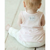 baby girl wearing soft cotton pink tank top and organic baby pants