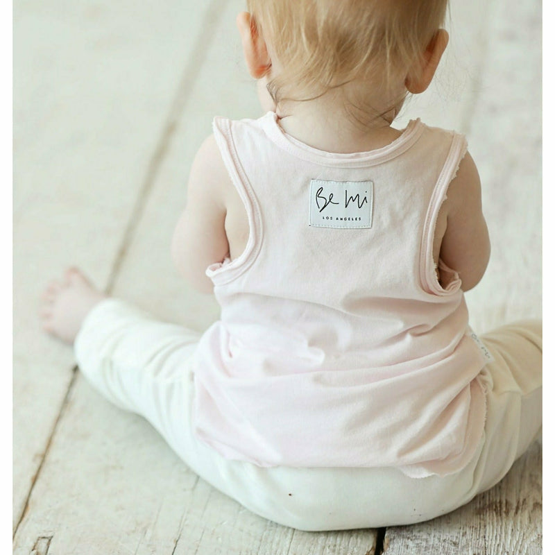 soft cotton baby tank yp[ in pink and organic cream pants on baby girl