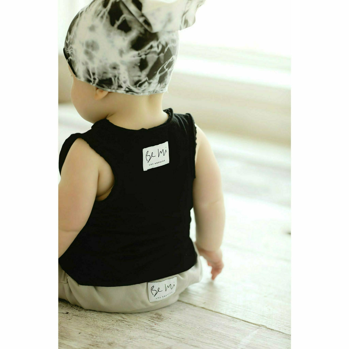 Black Asher Baby Tank Top by Be Mi Los Angeles, soft cotton sleeveless shirt for infants, with simple design and comfortable fit.