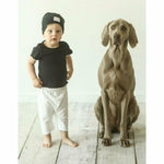 boy wearing soft organic tee and beanie and shorts blac kwhite with big dog