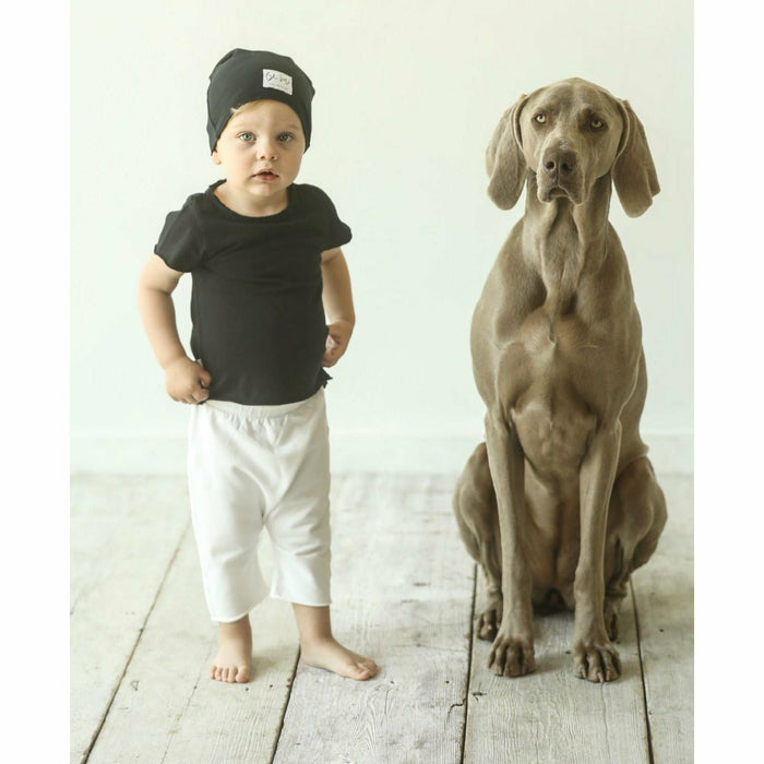 Soft organic baby beanie by Be Mi Los Angeles in pastel pink, made from breathable fabric for comfortable infant wear.