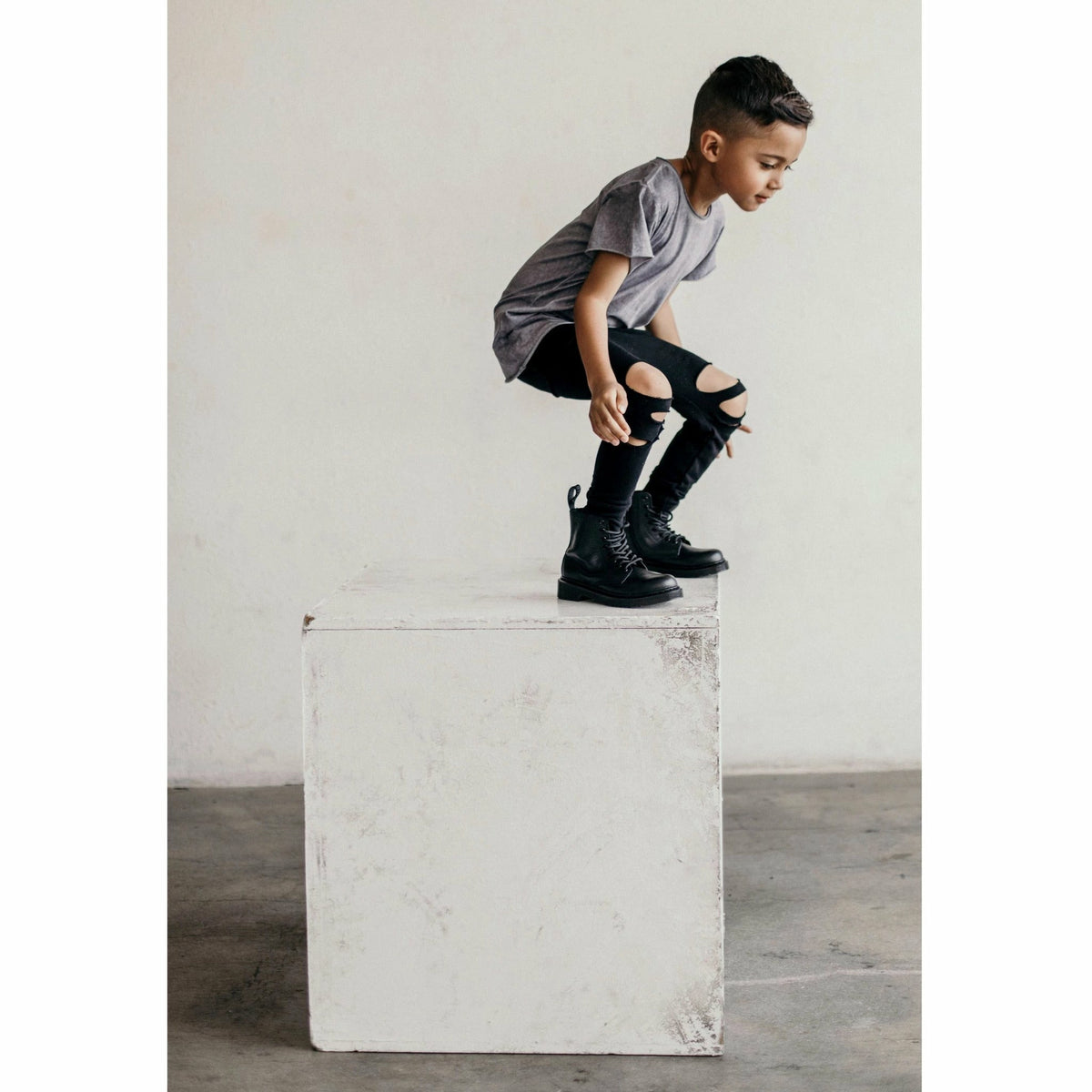 Be Mi Los Angeles Raw Edge Tee displayed on a model, showcasing its casual, distressed neckline and soft cotton fabric.