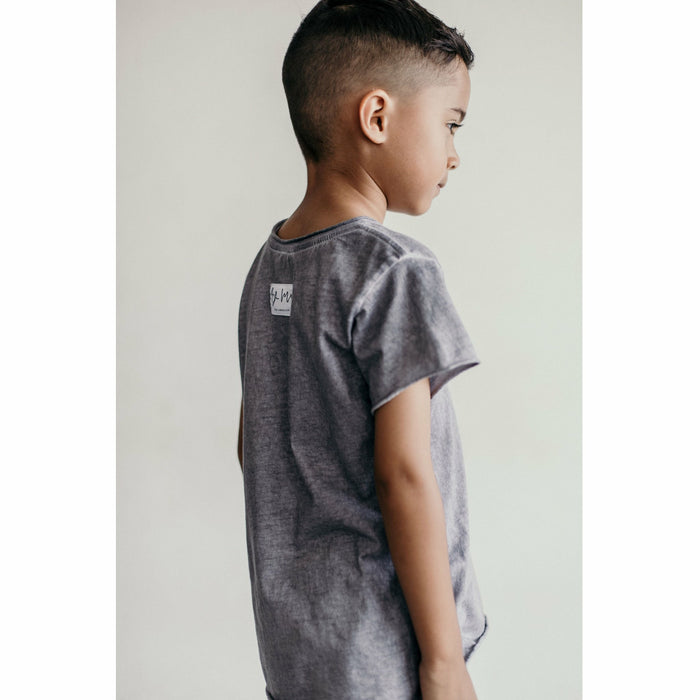 Be Mi Los Angeles Raw Edge Tee displayed on a hanger, showcasing its casual style and raw-edge design.