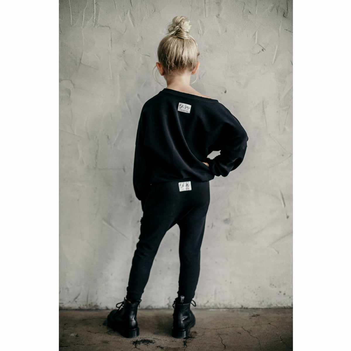 Black organic Malibu joggers by Be Mi Los Angeles with distressed details, casual fit, and comfortable fabric.