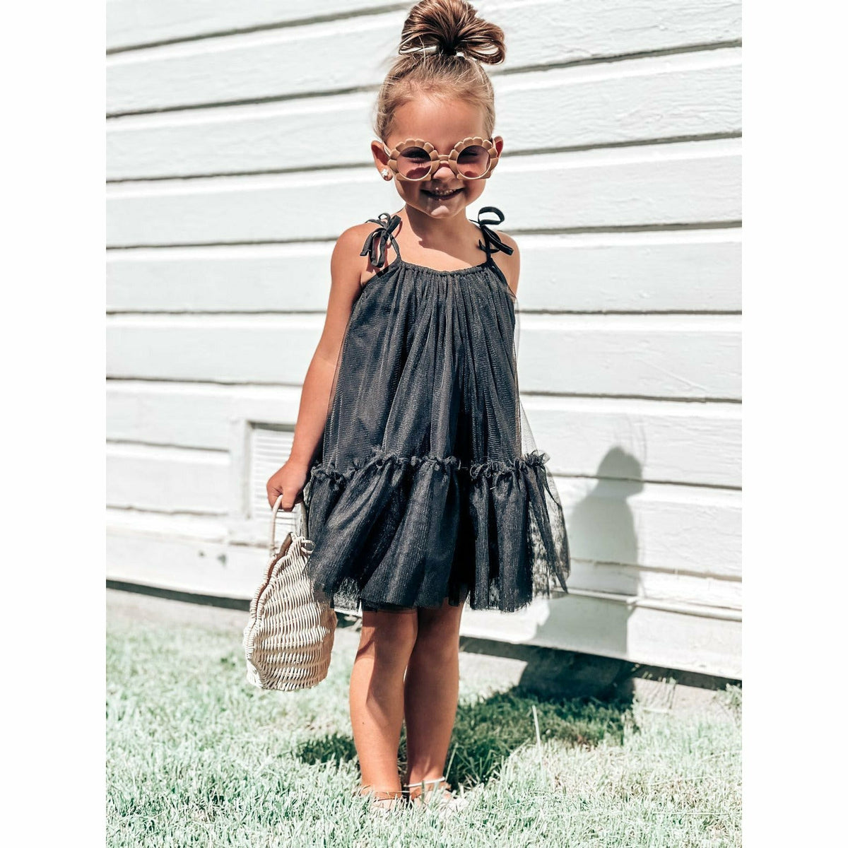 Black Mila dress by Be Mi Los Angeles, stylish sleeveless dress with a fitted silhouette and elegant design.