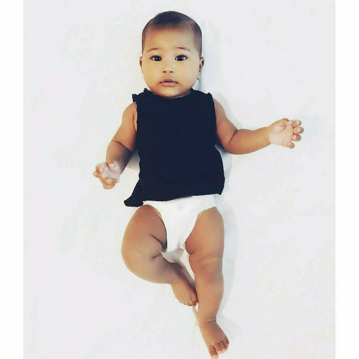 Black Asher Baby Tank Top by Be Mi Los Angeles, soft cotton sleeveless shirt for infants with a simple, comfortable design.