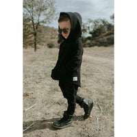 Black organic Benji kids' hoodie by Be Mi Los Angeles, cozy sweatshirt for children, with a comfortable fit and soft fabric.