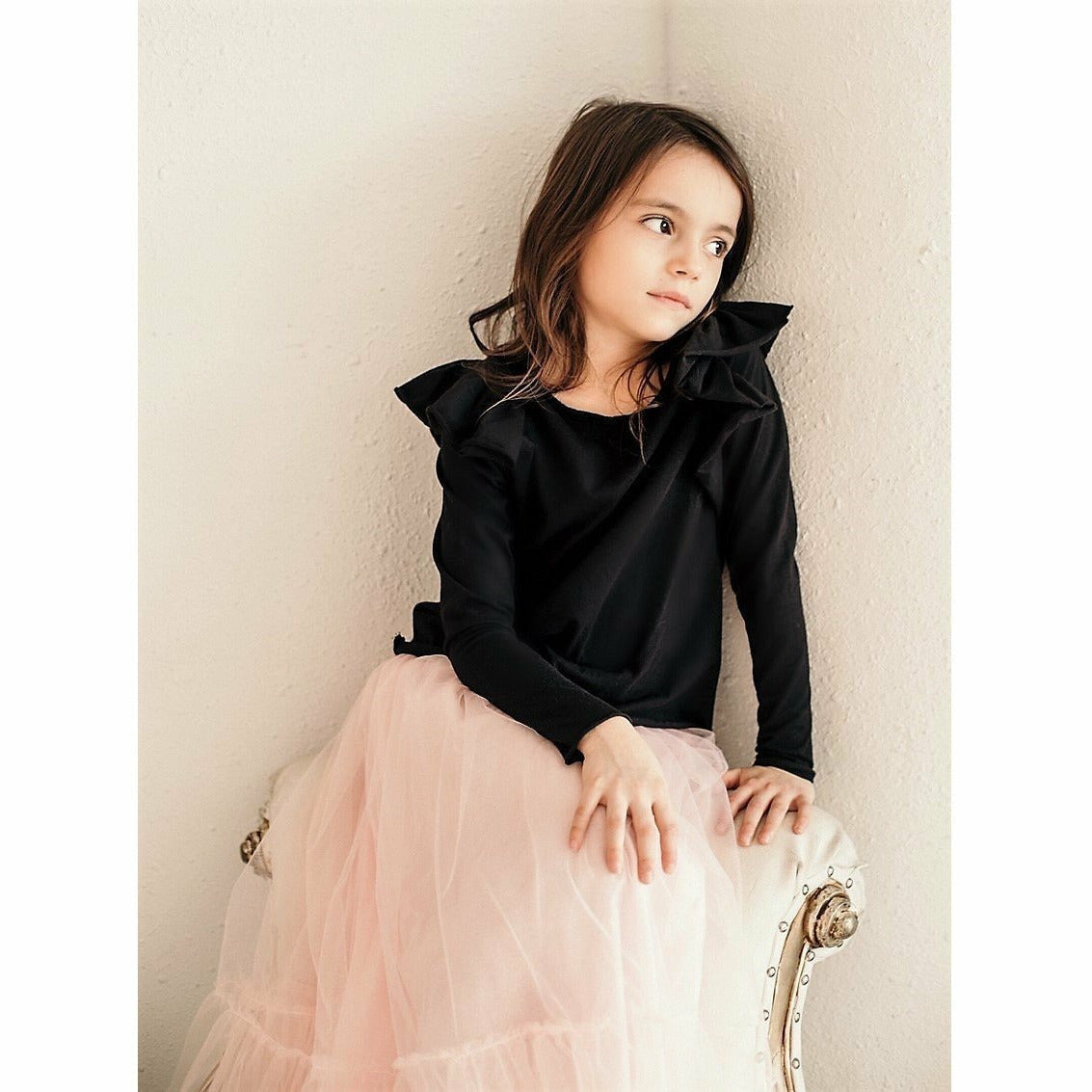 Be Mi Los Angeles Natalia Ruffle Top, stylish women's top with ruffle details and feminine design, shown in a close-up image.