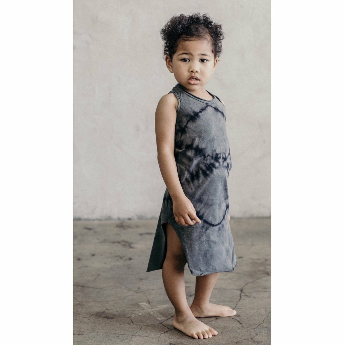 Be Mi Los Angeles Lexi Tank Dress in zebra print, dark color, sleeveless design, lightweight and stylish for casual wear.