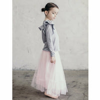 Be Mi Los Angeles Natalia Ruffle Top, stylish women's top with ruffle details, displayed on a hanger.