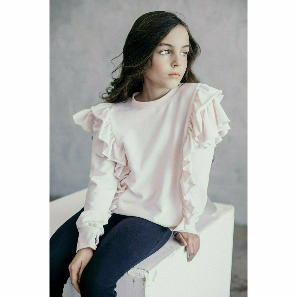 Black organic Victoria ruffle sleeve top by Be Mi Los Angeles, front view showcasing ruffled sleeve details and relaxed fit.