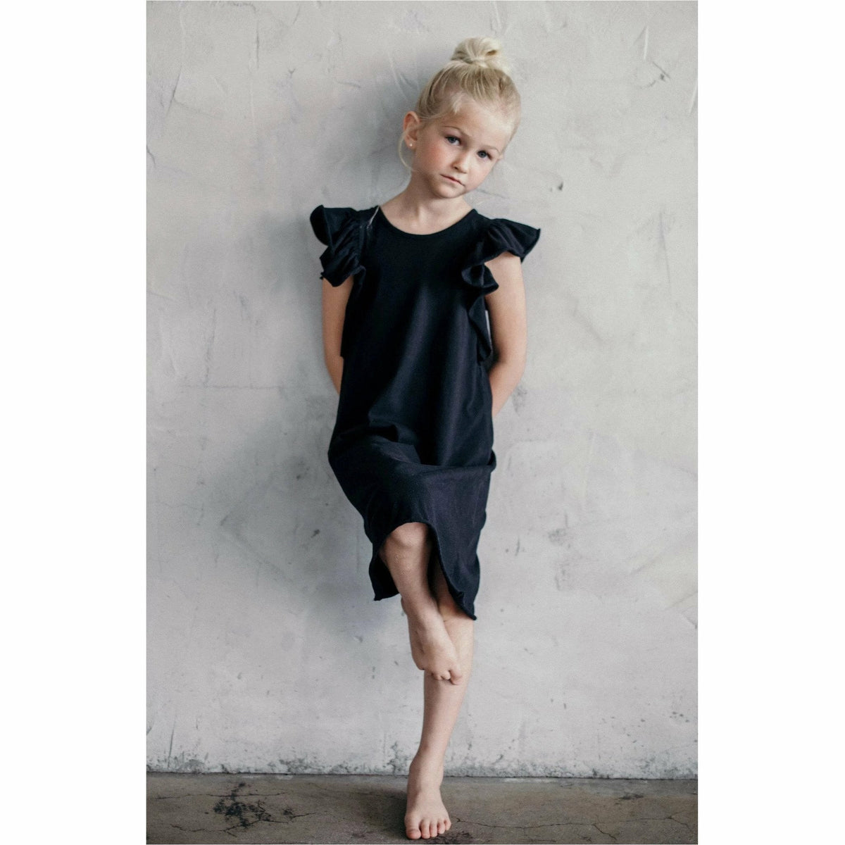Black Valentina Ruffle Dress by Be Mi Los Angeles featuring ruffled details and a stylish fit, perfect for elegant occasions.