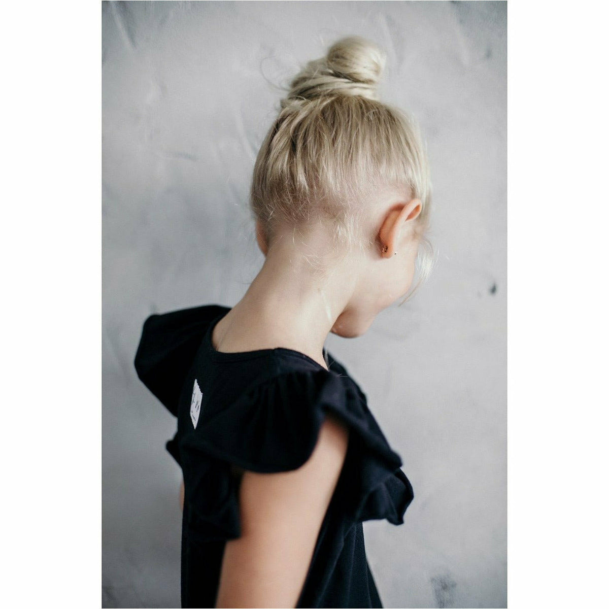 Be Mi Los Angeles Valentina Ruffle Dress, elegant dress with ruffle details, displayed on a hanger against a neutral background.