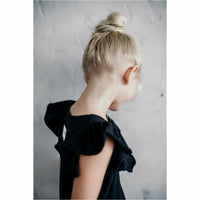 Be Mi Los Angeles Valentina Ruffle Dress, elegant dress with ruffle details, displayed on a hanger against a neutral background.