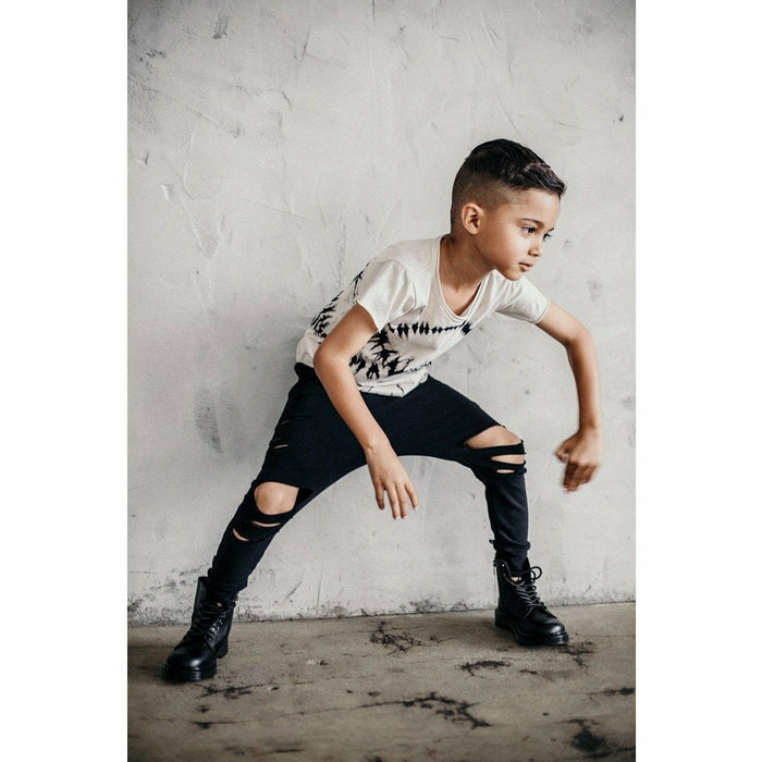 Black distressed organic Malibu joggers by Be Mi Los Angeles, showcasing relaxed fit and stylish casual wear.